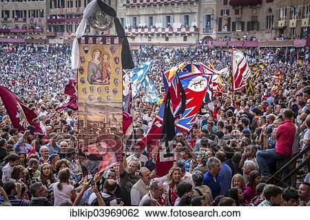 "The winning team of the Palio di Siena is awarded a banner of painted silk, Palio, which they carry through the streets, Piazza del Campo, Siena, Tuscany, Italy, Europe" View Large Photo Image Stock Image - "The winning team of the Palio di Siena is awarded a banner of painted silk, Palio, which they carry through the streets, Piazza del Campo, Siena, Tuscany, Italy, Europe". Fotosearch