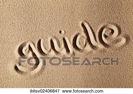 "The word guide, written in sand" View Large Photo Image Stock Photo - "The word guide, written in sand". Fotosearch