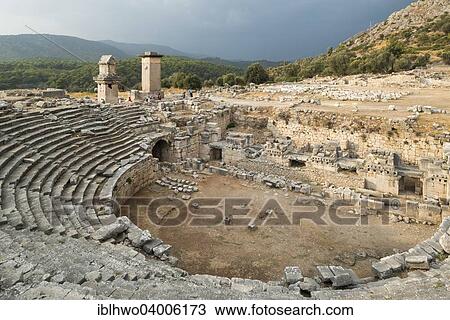 Stock Image - "Theatre and Lycian tombs, ancient city of Xanthos, UNESCO World Heritage Site, near Fethiye, Antalya Province, Turkey, Asia". Fotosearch