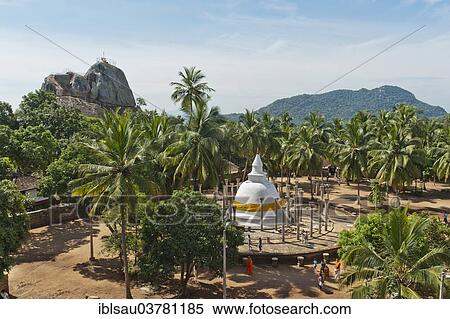 "Theravada Buddhism, white stupa, Dagoba surrounded with stone columns under palm trees, Ambastala Vatadage, Buddhist monastery complex of Mihintale, Anuradhapura, Sri Lanka, Asia" View Large Photo Image Stock Photography - "Theravada Buddhism, white stupa, Dagoba surrounded with stone columns under palm trees, Ambastala Vatadage, Buddhist monastery complex of Mihintale, Anuradhapura, Sri Lanka, Asia". Fotosearch