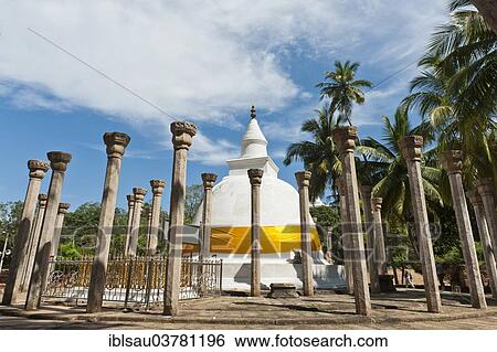 "Theravada Buddhism, white stupa with an orange band, Dagoba surrounded with stone columns under palm trees, Ambastala Vatadage, Buddhist monastery complex of Mihintale, Anuradhapura, Sri Lanka, Asia" View Large Photo Image Stock Photograph - "Theravada Buddhism, white stupa with an orange band, Dagoba surrounded with stone columns under palm trees, Ambastala Vatadage, Buddhist monastery complex of Mihintale, Anuradhapura, Sri Lanka, Asia". Fotosearch