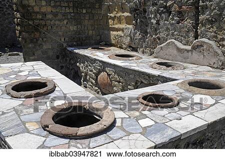 "Thermopolium, former restaurant, kitchen, archaeological site, Herculaneum, Ercolano, Naples, Campania, Italy, Europe" View Large Photo Image Stock Image - "Thermopolium, former restaurant, kitchen, archaeological site, Herculaneum, Ercolano, Naples, Campania, Italy, Europe". Fotosearch