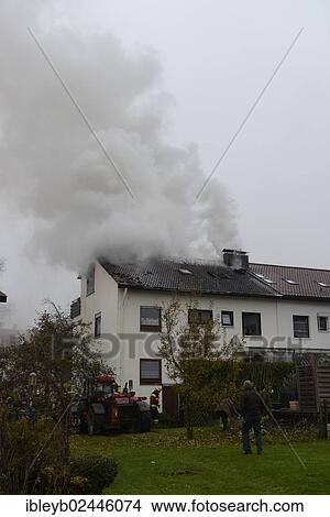 "Thick smoke escaping from the roof during a roof fire, Aichwald, Baden-Wurttemberg, Germany, Europe" View Large Photo Image Picture - "Thick smoke escaping from the roof during a roof fire, Aichwald, Baden-Wurttemberg, Germany, Europe". Fotosearch