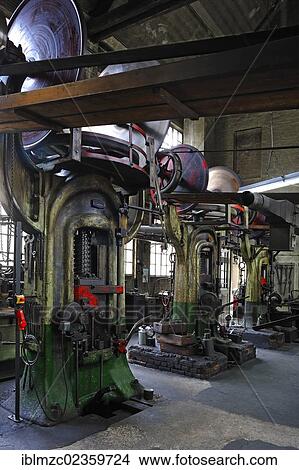 Picture - "Three big screw presses in a drop-forging workshop, formerly the factory of Dietz and Pfriem, 1911, today an industrial museum, Lauf, Middle Franconia, Bavaria, Germany, Europe". Fotosearch