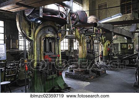 "Three big screw presses in a drop-forging workshop, formerly the factory of Dietz and Pfriem, 1911, today an industrial museum, Lauf, Middle Franconia, Bavaria, Germany, Europe" View Large Photo Image Stock Photo - "Three big screw presses in a drop-forging workshop, formerly the factory of Dietz and Pfriem, 1911, today an industrial museum, Lauf, Middle Franconia, Bavaria, Germany, Europe". Fotosearch