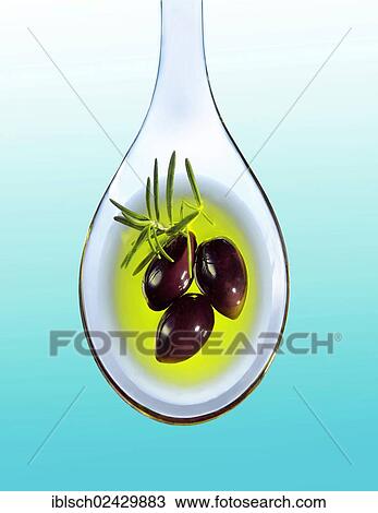 Three black olives on an acrylic spoon in olive oil with a sprig of rosemary View Large Photo Image Stock Image - Three black olives on an acrylic spoon in olive oil with a sprig of rosemary. Fotosearch