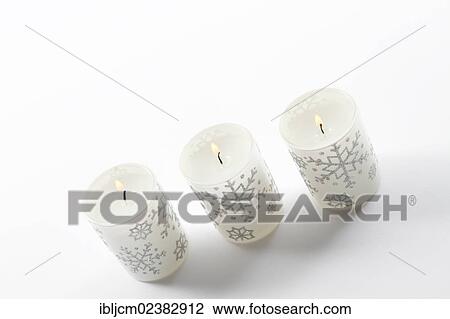 Three burning Christmas candles View Large Photo Image Stock Image - Three burning Christmas candles. Fotosearch