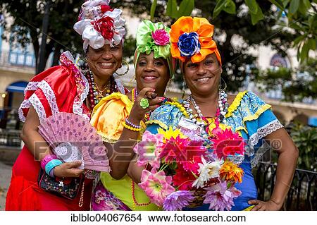 Picture - "Three Cuban women in colorful Spanish-inspired costumes, Havana, Cuba, North America". Fotosearch