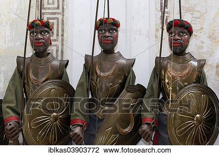 "Three dark-skinned Moor-warriors in armour, Opera dei Pupi or Sicilian puppet theatre, museum Museo Internazionale delle marionette Antonio Pasqualino, Palermo, Sicily, Italy, Europe" View Large Photo Image Stock Image - "Three dark-skinned Moor-warriors in armour, Opera dei Pupi or Sicilian puppet theatre, museum Museo Internazionale delle marionette Antonio Pasqualino, Palermo, Sicily, Italy, Europe". Fotosearch