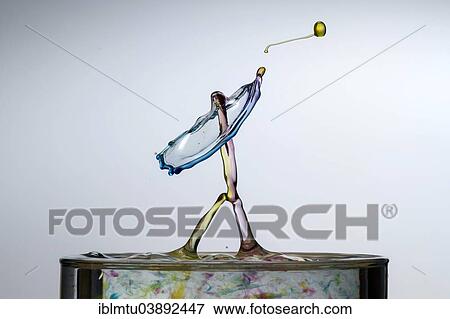 Stock Photo - Three different coloured drops colliding. Fotosearch