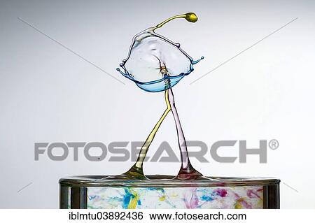 Three different coloured drops colliding View Large Photo Image Stock Photograph - Three different coloured drops colliding. Fotosearch