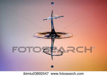 Stock Photo - "Three drops collide, the first forms a column, the second produces the shield, followed by the third, digitally controlled with three valves". Fotosearch