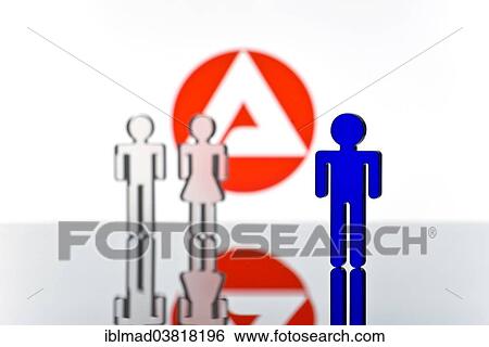 Stock Photograph - "Three figures standing in front of the logo of the German employment agency, symbolic picture for unemployment". Fotosearch