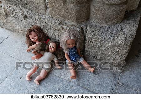 "Three forgotten children's dolls beside a medieval column, Knight Street or Odos Hippoton, historic town centre, Rhodes, Island of Rhodes, Dodecanese, Greece, Europe" View Large Photo Image Stock Photo - "Three forgotten children's dolls beside a medieval column, Knight Street or Odos Hippoton, historic town centre, Rhodes, Island of Rhodes, Dodecanese, Greece, Europe". Fotosearch