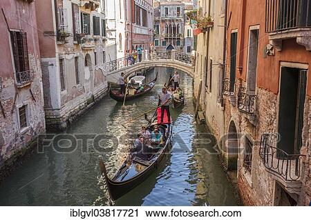 "Three gondolas with passengers on a canal, Venice, Italy, Europe" View Large Photo Image Stock Image - "Three gondolas with passengers on a canal, Venice, Italy, Europe". Fotosearch