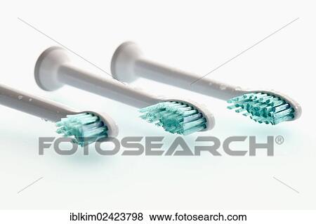Three heads of toothbrushes, electric toothbrush View Large Photo Image Stock Photo - Three heads of toothbrushes, electric toothbrush. Fotosearch