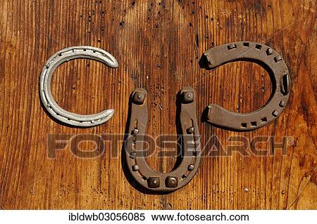 "Three horseshoes attached to the door to the Elmauer Hut, near Mittenwald, Werdenfelser Land, Upper Bavaria, Bavaria, Germany, Europe" View Large Photo Image Stock Photography - "Three horseshoes attached to the door to the Elmauer Hut, near Mittenwald, Werdenfelser Land, Upper Bavaria, Bavaria, Germany, Europe". Fotosearch