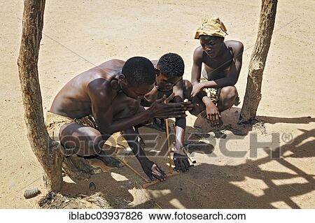 "Three local men making fire, Damara Living Museum, near Twyfelfontein, Namibia, Africa" View Large Photo Image Stock Photograph - "Three local men making fire, Damara Living Museum, near Twyfelfontein, Namibia, Africa". Fotosearch