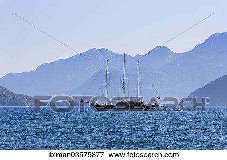 Stock Photo - "Three-master wth the Bozburun Peninsula at back, Marmaris, Provinz Mugla, Aegais, Turkey, Asia". Fotosearch