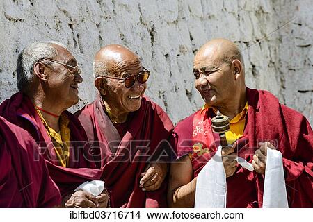 Picture - "Three monks in the courtyard of Lamayuru Gompa, Ladakh, Jammu and Kashmir, India, Asia". Fotosearch