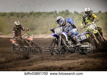 "Three motocross riders on a track during a race, Grevenbroich, North Rhine-Westphalia, Germany, Europe" View Large Photo Image Stock Image - "Three motocross riders on a track during a race, Grevenbroich, North Rhine-Westphalia, Germany, Europe". Fotosearch