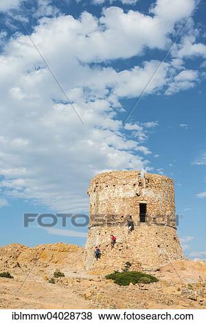 "Three people walking down from a Genoese tower, Gulf of Porto, Corsica, France, Europe" View Large Photo Image Stock Photo - "Three people walking down from a Genoese tower, Gulf of Porto, Corsica, France, Europe". Fotosearch