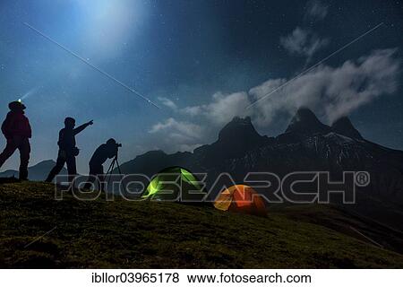 "Three photographers backpacking in front of the Les Aiguilles d'Arves mountain, night shot, Pelvoux, Dauphine Alps, Savoie, France, Europe" View Large Photo Image Stock Photo - "Three photographers backpacking in front of the Les Aiguilles d'Arves mountain, night shot, Pelvoux, Dauphine Alps, Savoie, France, Europe". Fotosearch