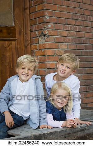 "Three siblings, 9, 7 and 4 years old" View Large Photo Image Stock Image - "Three siblings, 9, 7 and 4 years old". Fotosearch