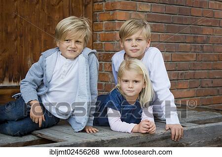 "Three siblings, 9, 7 and 4 years old" View Large Photo Image Stock Photo - "Three siblings, 9, 7 and 4 years old". Fotosearch