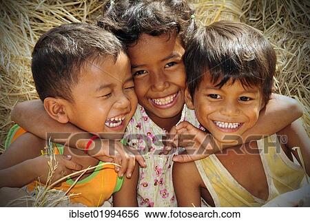 "Three smiling children in Cambodia, Southeast Asia, Asia" View Large Photo Image Stock Photograph - "Three smiling children in Cambodia, Southeast Asia, Asia". Fotosearch