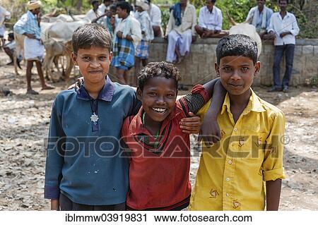 Stock Image - "Three smiling Indian children, Begur, Karnataka, India, Asia". Fotosearch