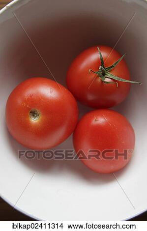 Three tomatoes in a bowl View Large Photo Image Picture - Three tomatoes in a bowl. Fotosearch
