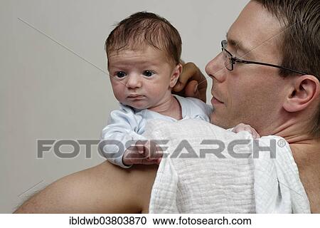 "Three-week-old infant boy being held over his shoulder by his father, with burp cloth" View Large Photo Image Stock Image - "Three-week-old infant boy being held over his shoulder by his father, with burp cloth". Fotosearch