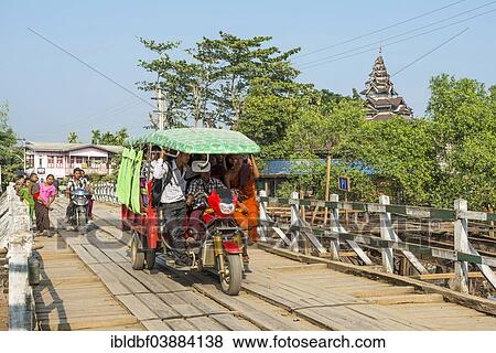 "Three-wheeled tuk tuk on a bridge, Mrauk U, Sittwe District, Rakhine State, Myanmar, Asia" View Large Photo Image Stock Photo - "Three-wheeled tuk tuk on a bridge, Mrauk U, Sittwe District, Rakhine State, Myanmar, Asia". Fotosearch