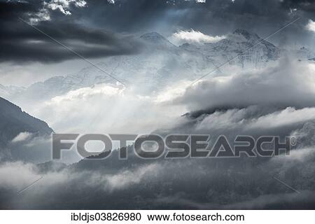 Stock Image - "Thunderstorm clounds over Eiger mountain and Monch mountain, Beatenberg, Bernese Oberland, Canton Bern, Switzerland, Europe". Fotosearch