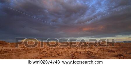 Stock Image - "Thunderstorm, eroded entrada sandstone hoodoos and rock formations, Goblins, Goblin Valley State Park, San Rafael Reef Desert, Utah, Southwestern USA, USA". Fotosearch