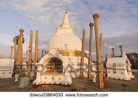 Stock Image - "Thuparama Dagoba, decorated with golden bandages, in the evening light, Anuradhapura, Sri Lanka, Asia". Fotosearch