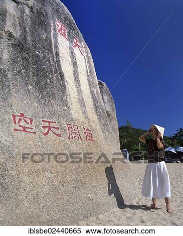 "Tianya Haijiao, The End of Heaven and Edge of the Sea, woman in front of rocks with inscriptions, Sanya, rock formation at the southern tip of Hainan Island, China, Asia" View Large Photo Image Stock Photography - "Tianya Haijiao, The End of Heaven and Edge of the Sea, woman in front of rocks with inscriptions, Sanya, rock formation at the southern tip of Hainan Island, China, Asia". Fotosearch