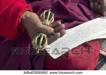 "Tibetean monk reading the holy scriptures in Tibetan language, at the foot of Boudnath Stupa, Kathmandu Valley, Kathmandu, Kathmandu District, Bagmati Zone, Nepal, Asia" View Large Photo Image Stock Image - "Tibetean monk reading the holy scriptures in Tibetan language, at the foot of Boudnath Stupa, Kathmandu Valley, Kathmandu, Kathmandu District, Bagmati Zone, Nepal, Asia". Fotosearch