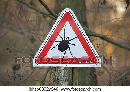 Stock Photograph - "Tick â€‹â€‹warning sign, Lower Saxony, Germany, Europe". Fotosearch