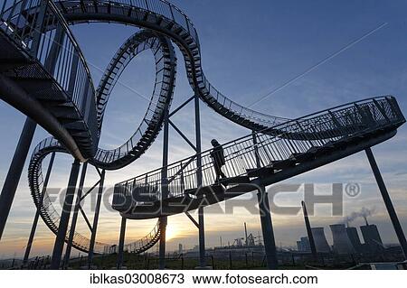 "Tiger & Turtle - Magic Mountain"""", landmark, accessible sculpture shaped like a roller coaster, Angerpark, Angerhausen, Duisburg, Ruhr district, North Rhine-Westphalia, Germany, Europe" View Large Photo Image Stock Image - "Tiger & Turtle - Magic Mountain"""", landmark, accessible sculpture shaped like a roller coaster, Angerpark, Angerhausen, Duisburg, Ruhr district, North Rhine-Westphalia, Germany, Europe". Fotosearch