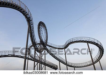 "Tiger & Turtle - Magic Mountain"""", landmark, accessible sculpture shaped like a roller coaster, Angerpark, Angerhausen, Duisburg, Ruhr district, North Rhine-Westphalia, Germany, Europe" View Large Photo Image Stock Image - "Tiger & Turtle - Magic Mountain"""", landmark, accessible sculpture shaped like a roller coaster, Angerpark, Angerhausen, Duisburg, Ruhr district, North Rhine-Westphalia, Germany, Europe". Fotosearch