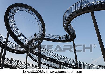 "Tiger & Turtle - Magic Mountain"""", landmark, accessible sculpture shaped like a roller coaster, Angerpark, Angerhausen, Duisburg, Ruhr district, North Rhine-Westphalia, Germany, Europe" View Large Photo Image Stock Photography - "Tiger & Turtle - Magic Mountain"""", landmark, accessible sculpture shaped like a roller coaster, Angerpark, Angerhausen, Duisburg, Ruhr district, North Rhine-Westphalia, Germany, Europe". Fotosearch
