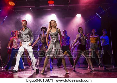 Stock Image - "Tino Andrea Honegger and Julia Fechter starring as Tony Manero and Stephanie Mangano in the musical """"Saturday Night Fever"""", Le Theatre, Kriens, Lucerne, Switzerland, Europe". Fotosearch