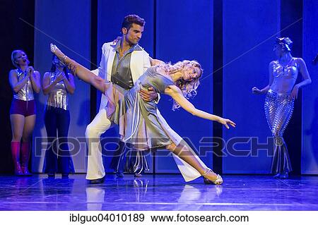 "Tino Andrea Honegger and Julia Fechter starring as Tony Manero and Stephanie Mangano in """"Saturday Night Fever"""" - The Musical at Le Theatre, Kriens, Lucerne, Switzerland, Europe" View Large Photo Image Stock Photo - "Tino Andrea Honegger and Julia Fechter starring as Tony Manero and Stephanie Mangano in """"Saturday Night Fever"""" - The Musical at Le Theatre, Kriens, Lucerne, Switzerland, Europe". Fotosearch