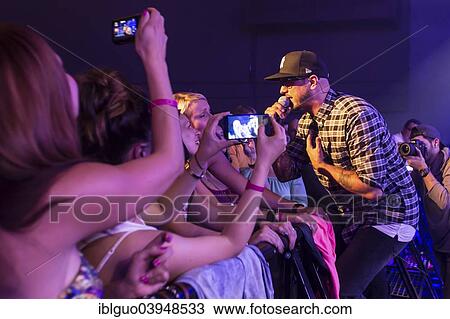 "Tino Oac, singer of the German band """"Sohne Mannheims"""" with front row fans, performing live at the Blue Balls Festival, Lucerne, Switzerland, Europe" View Large Photo Image Stock Image - "Tino Oac, singer of the German band """"Sohne Mannheims"""" with front row fans, performing live at the Blue Balls Festival, Lucerne, Switzerland, Europe". Fotosearch