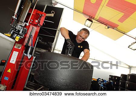 "Tire fitter in action during a race at the Nuerburgring race track, Nurburg, Rhineland-Palatinate, Germany, Europe" View Large Photo Image Stock Photo - "Tire fitter in action during a race at the Nuerburgring race track, Nurburg, Rhineland-Palatinate, Germany, Europe". Fotosearch