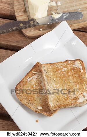 Stock Photo - Toast with butter. Fotosearch