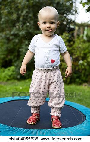 "Toddler, 18 months, on a trampoline in the garden" View Large Photo Image Stock Photograph - "Toddler, 18 months, on a trampoline in the garden". Fotosearch