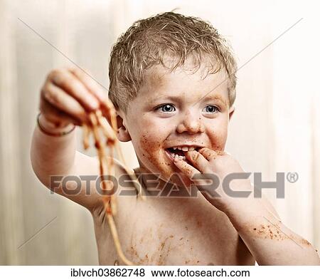 Toddler eating Spaghetti View Large Photo Image Stock Photo - Toddler eating Spaghetti. Fotosearch